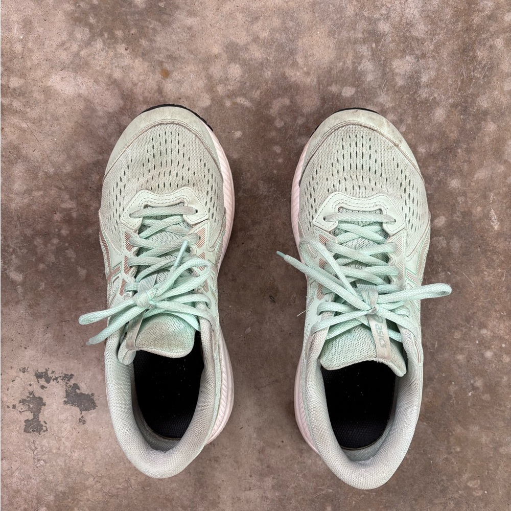Well worn women’s ASICS sneakers size 9